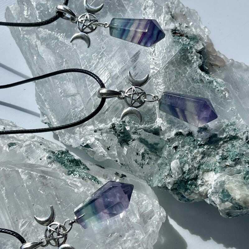 This is a rainbow fluorite pendant with triple goddess and pentacle. for connection and protection thecrystalcave.com.au