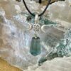 This is a green fluorite pendant with triple goddess and pentacle. for connection and protection thecrystalcave.com.au