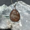 This is a beautiful Tear drop shaped golden rutile cabochon pendant. It is set in 925 silver. thecrystalcave.com.au