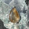 This is a beautiful Tear drop shaped golden rutile cabochon pendant. It is set in 925 silver. thecrystalcave.com.au