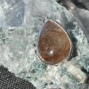 This is a beautiful Tear drop shaped golden rutile cabochon pendant. It is set in 925 silver. thecrystalcave.com.au