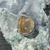 This is a beautiful Tear drop shaped golden rutile cabochon pendant. It is set in 925 silver. thecrystalcave.com.au