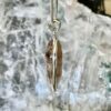 This is a beautiful Tear drop shaped golden rutile cabochon pendant. It is set in 925 silver. thecrystalcave.com.au
