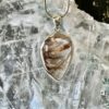 This is a beautiful Tear drop shaped golden rutile cabochon pendant. It is set in 925 silver. thecrystalcave.com.au