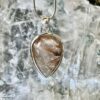 This is a beautiful Tear drop shaped golden rutile cabochon pendant. It is set in 925 silver. thecrystalcave.com.au