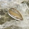 This is a beautiful Tear drop shaped golden rutile cabochon pendant. It is set in 925 silver. thecrystalcave.com.au