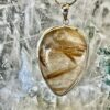 This is a beautiful Tear drop shaped golden rutile cabochon pendant. It is set in 925 silver. thecrystalcave.com.au