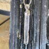 This is a Colombian Lemurian 'Blade of Light' pendant set in 925 silver. Water clear they are high vibrational stones, clarity and joy. thecrystalcave.com.au