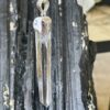 This is a Colombian Lemurian 'Blade of Light' pendant set in 925 silver. Water clear they are high vibrational stones, clarity and joy. thecrystalcave.com.au