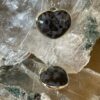 This is a Mystic Merlinite heart set in 927 silver pendant. Its energy opens the doorways of magic and ritual. Favoured for centuries by Druids and Shaman alike, its protective energies are revered, as it deflects negative energies.  thecrystalcave.com.au